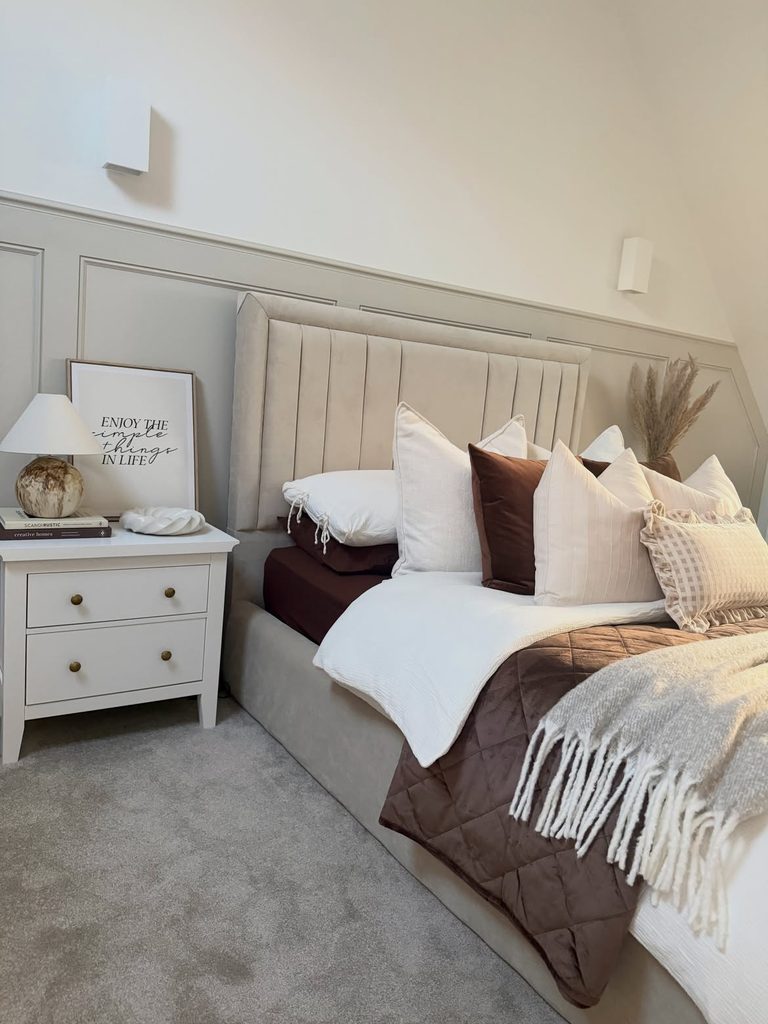 Bedroom Decor Ideas featuring a greige velvet upholstered bed with chocolate quilted throw and white nightstand