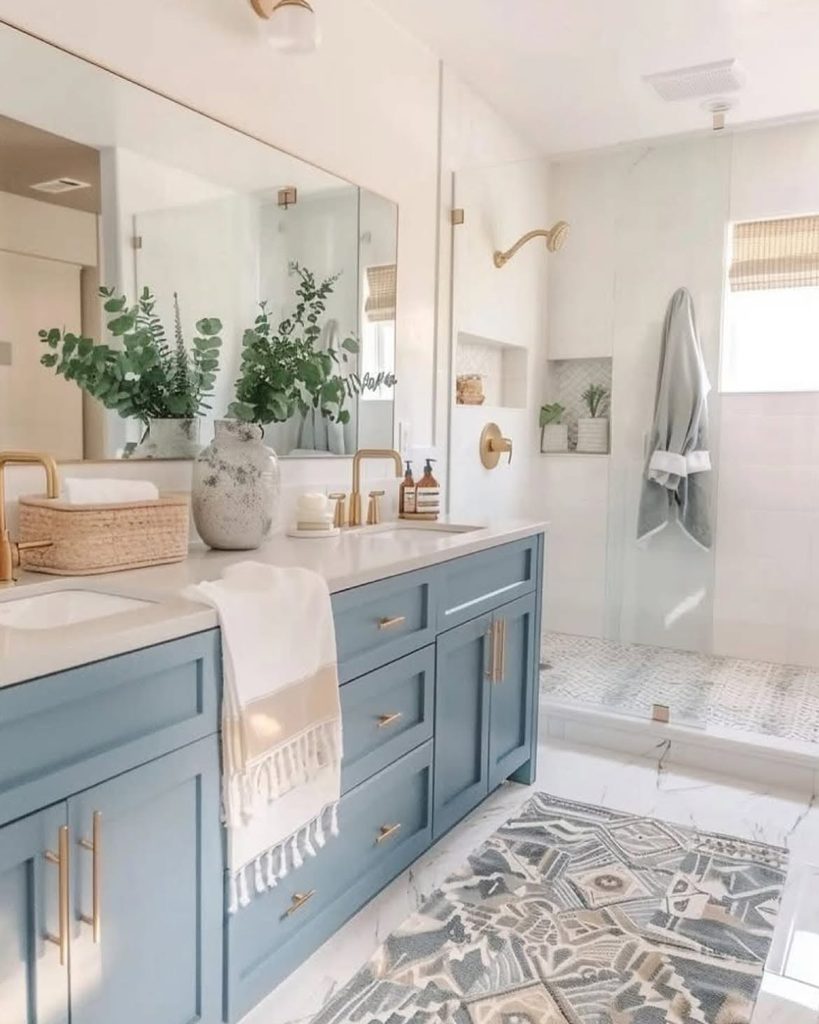 Blue Bathroom Ideas with slate blue double vanity, brushed brass faucets, and walk-in shower