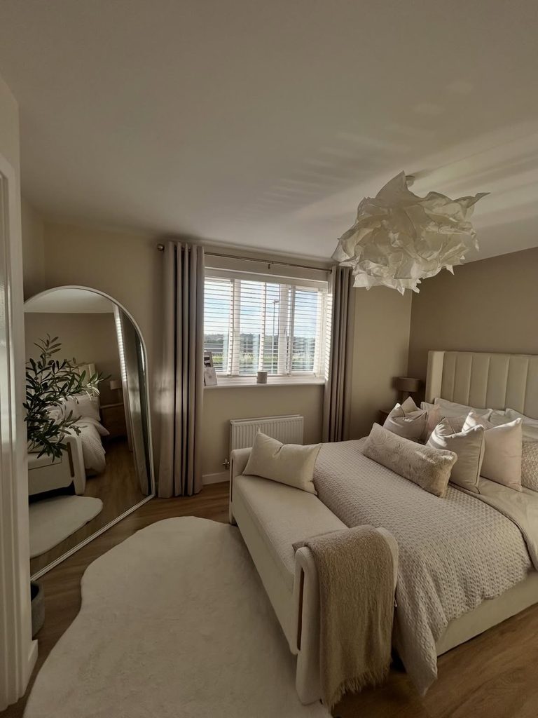 Bedroom Decor Ideas featuring cream boucle bed and sculptural paper ceiling light in mushroom taupe room